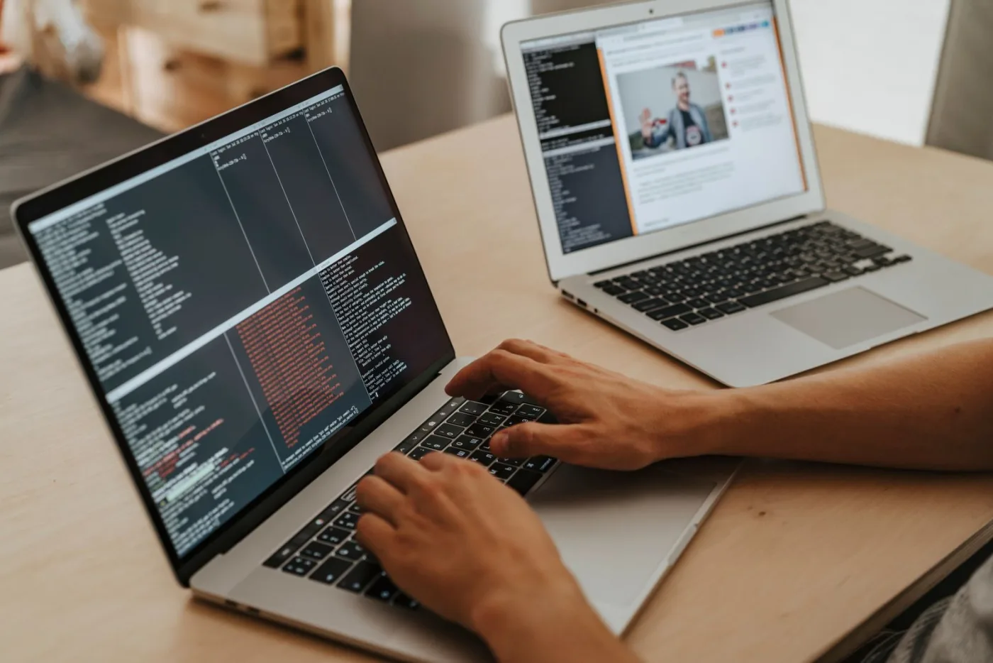 A developer working with business software on a laptop